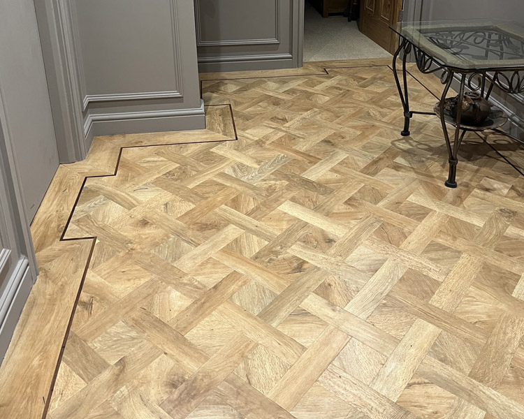 Bespoke flooring with perimeter border.